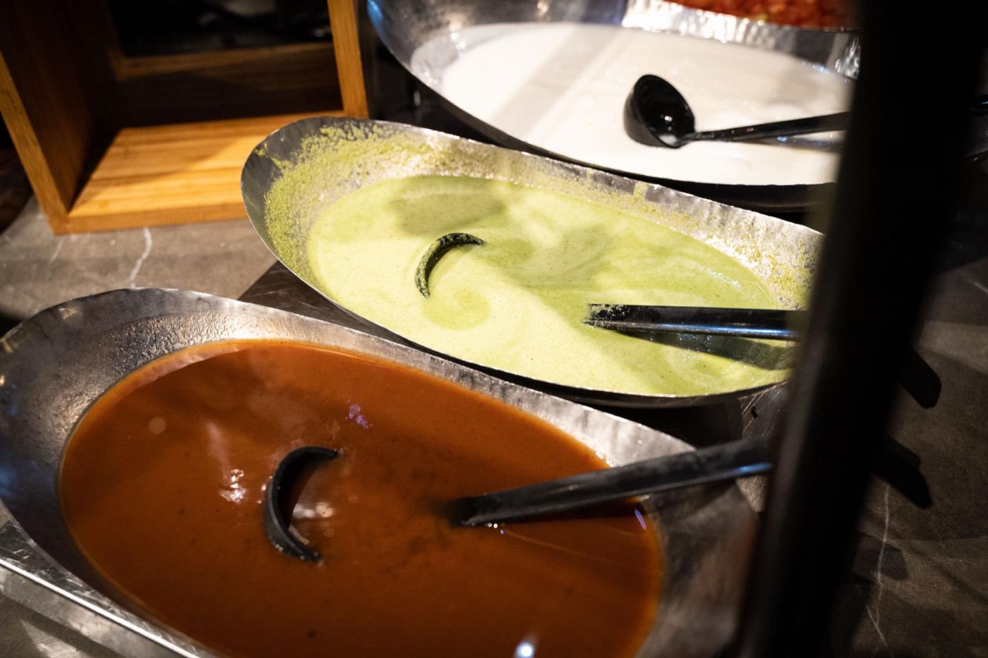 Green mint chutney, yogurt and tamarind chutney at the buffet chaat station at India 101 in Irving, TX