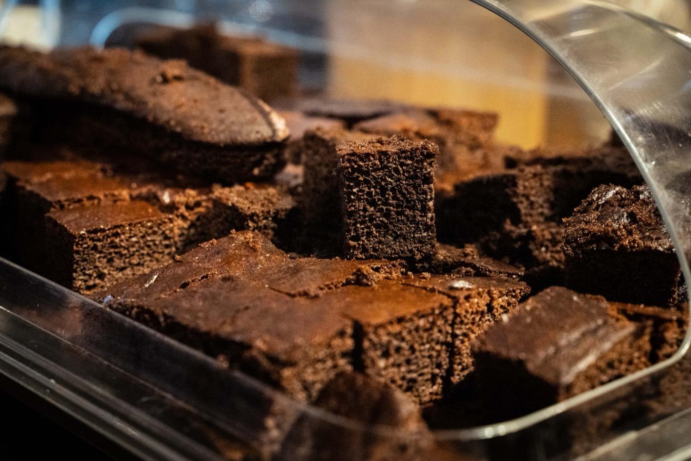 Tray of rich chocolate cake squares at India 101 dessert bar in Irving, TX