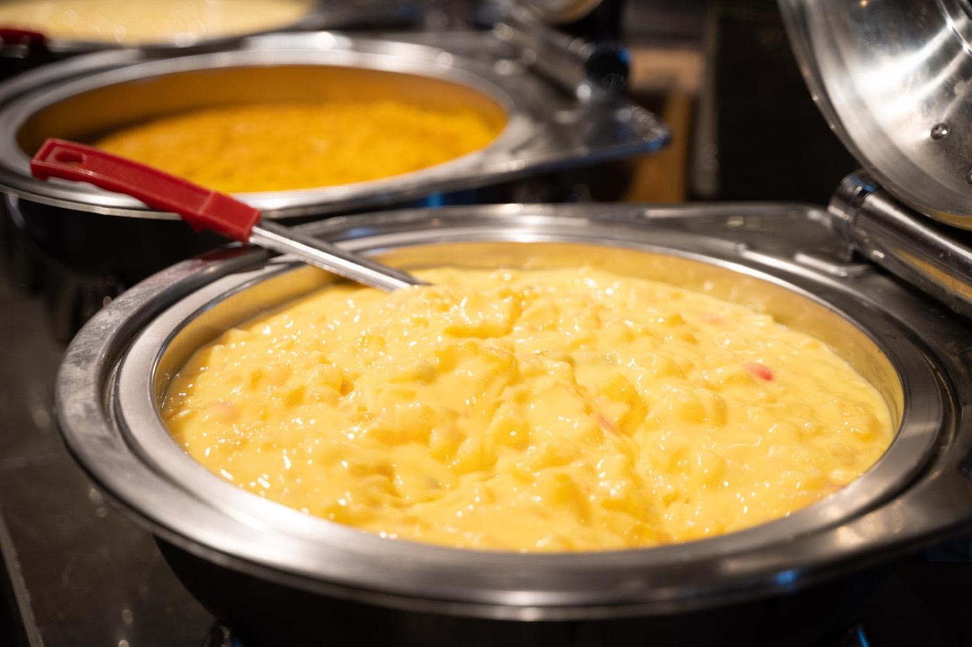 Chafer of creamy yellow Indian fruit custard dessert at India 101 in Irving, TX