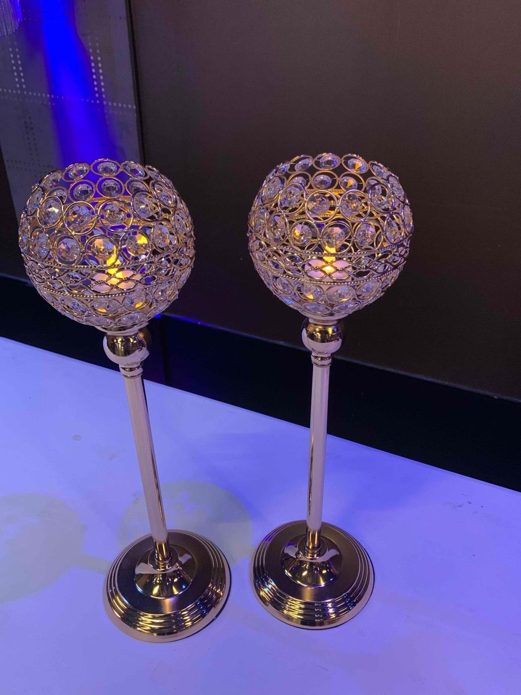 Gold crystal candle centerpieces styled for an event at India 101