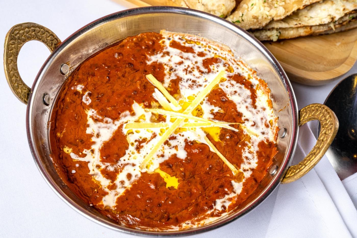 Close-up of dal makhani topped with cream and ginger at India 101 in Irving, TX