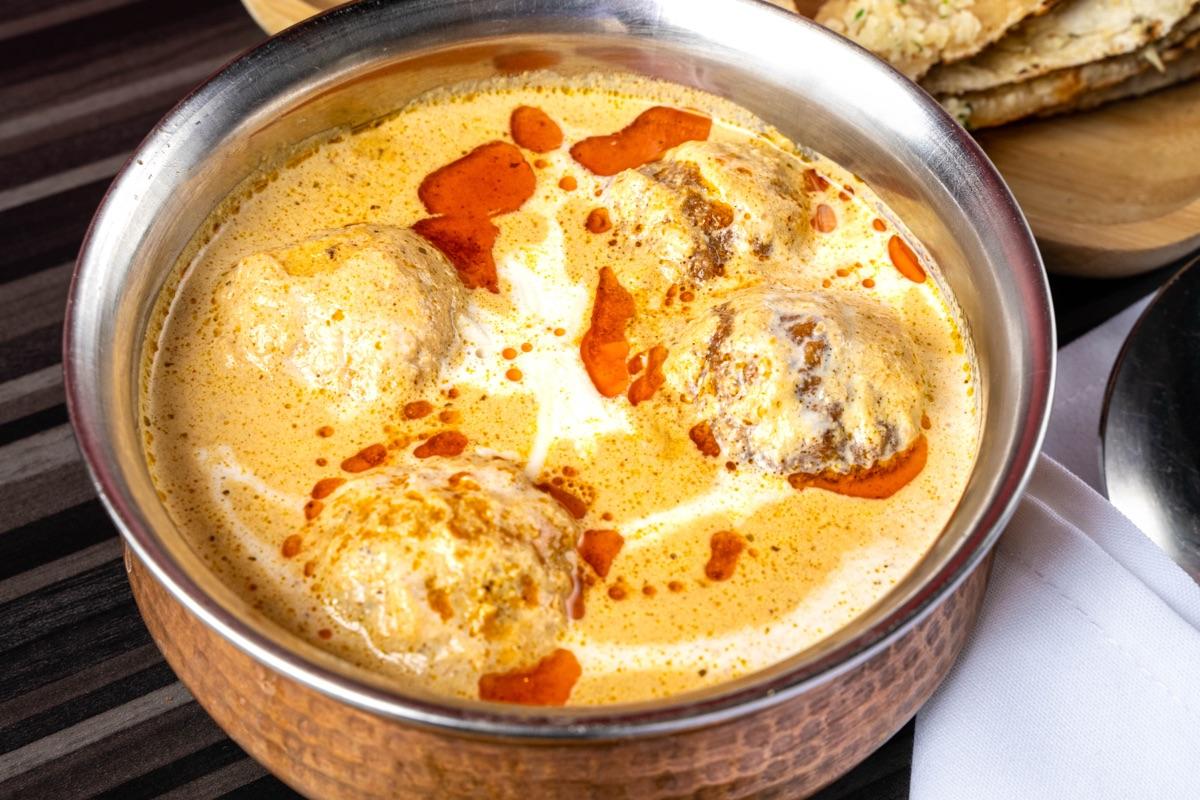 Malai kofta in a copper bowl