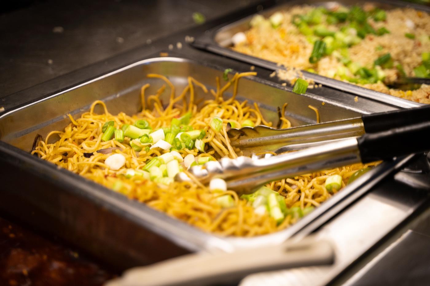 Vegetable Hakka noodles and fried rice in buffet trays at India 101
