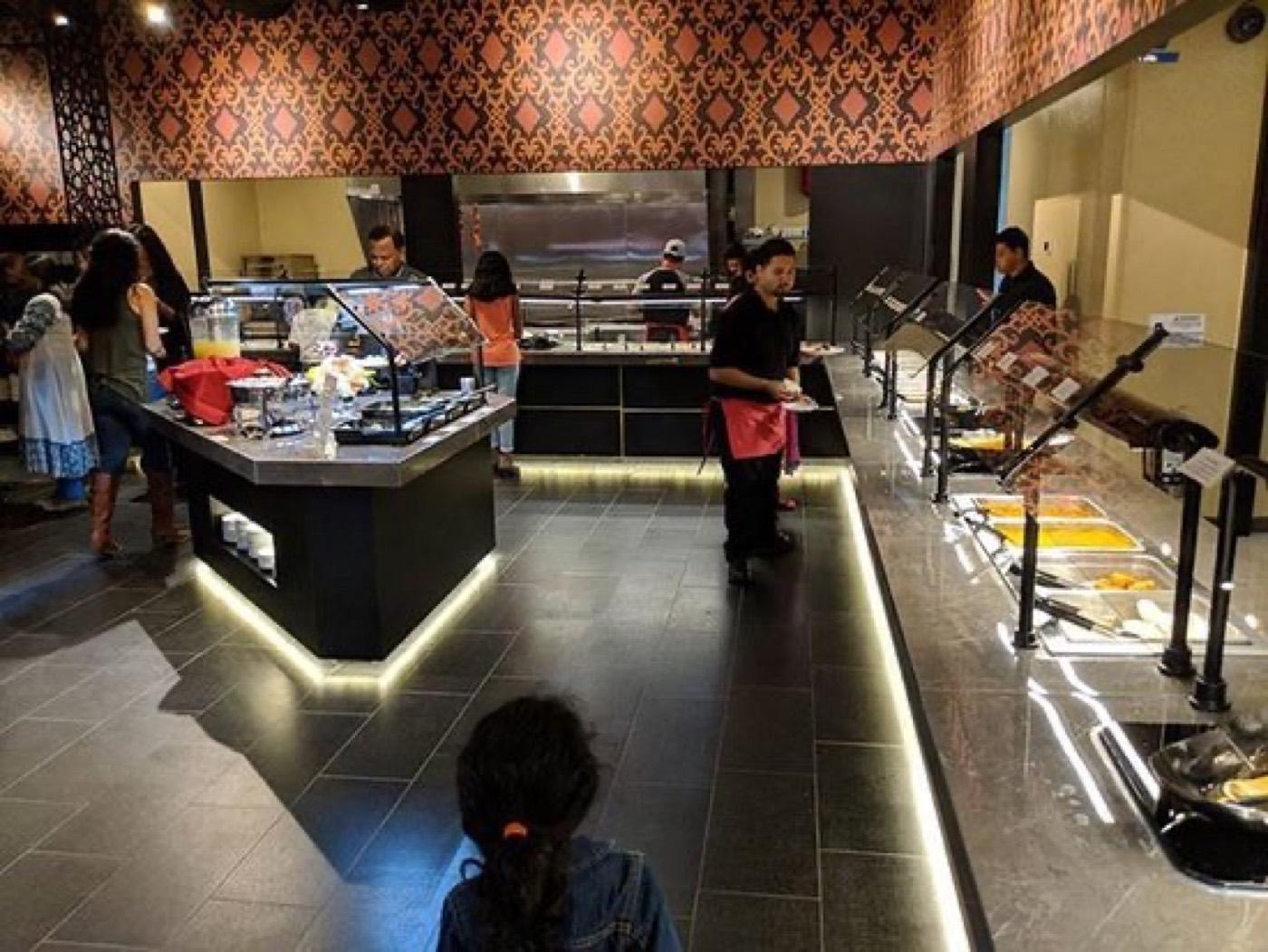 Guests serving from the live Indian buffet stations at India 101 in Irving, TX