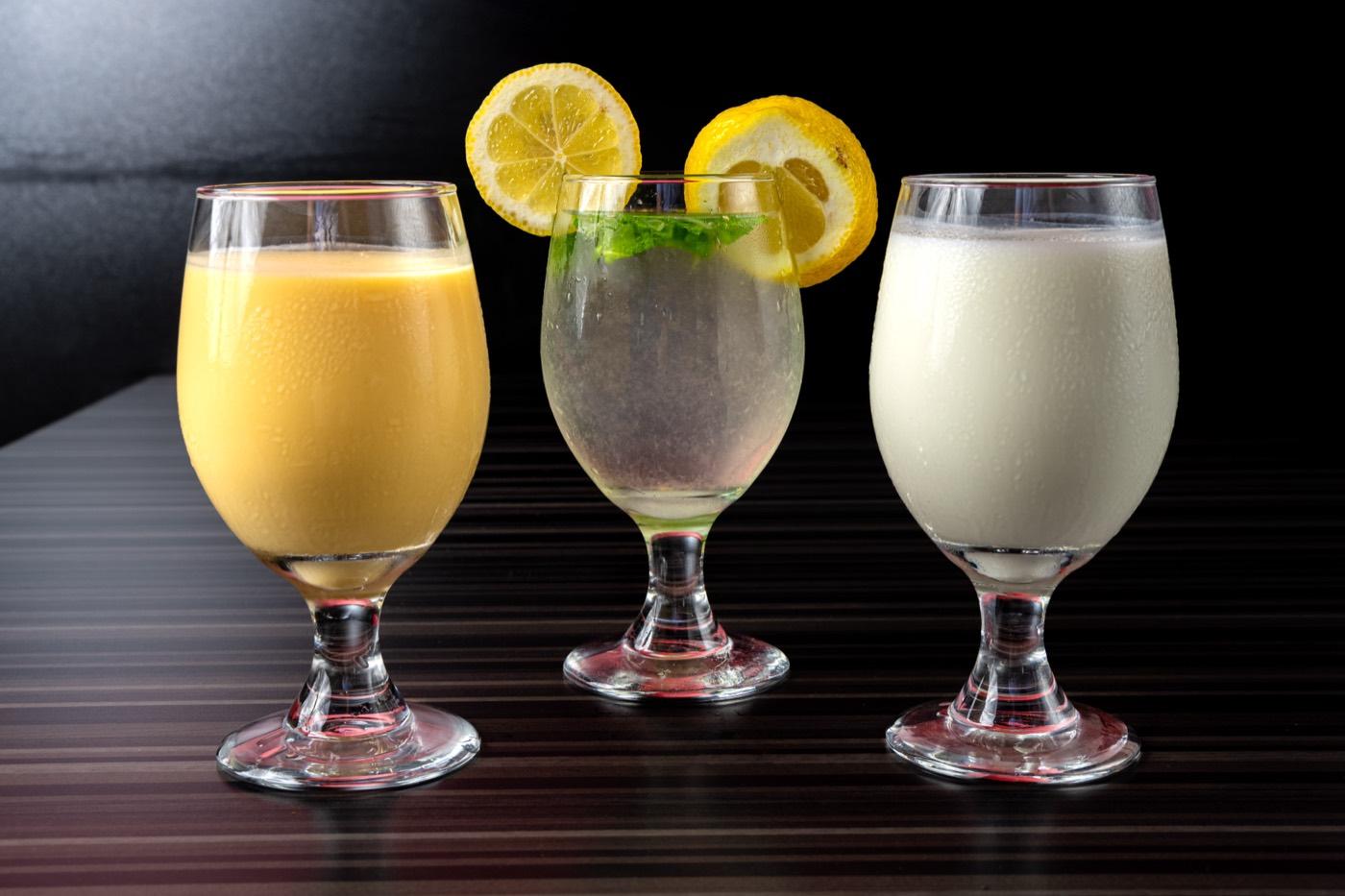 Trio of Indian drinks including mango lassi and a lemon-mint cooler at India 101 in Irving, TX