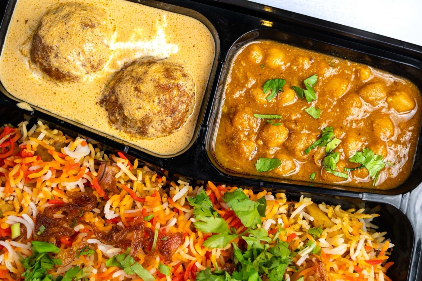 Close-up of vegetarian malai kofta and chole with biryani at India 101 in Irving, TX