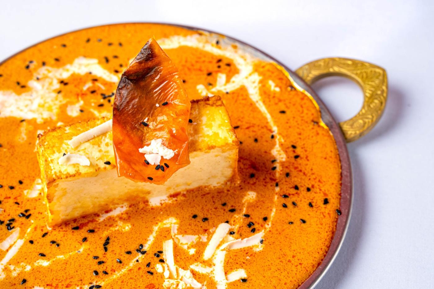 Vegetarian paneer in creamy orange makhani gravy with nigella seeds at India 101 in Irving, TX
