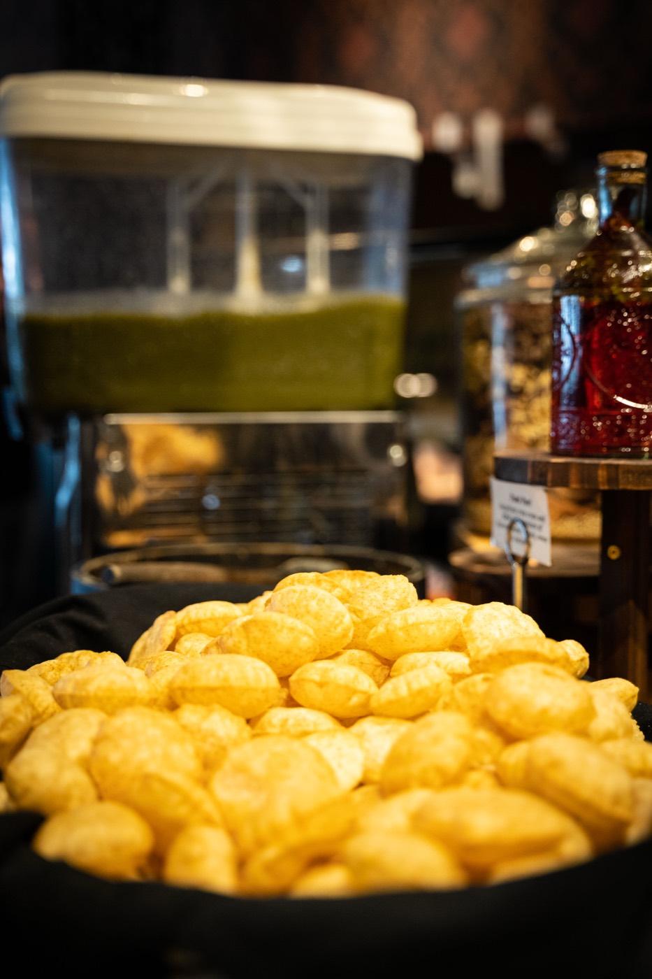 Close-up of crispy pani puri shells at India 101 buffet in Irving, TX