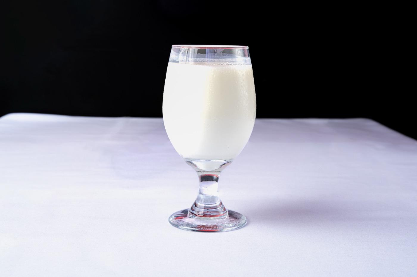 Glass of creamy sweet lassi yogurt drink at India 101 in Irving, TX