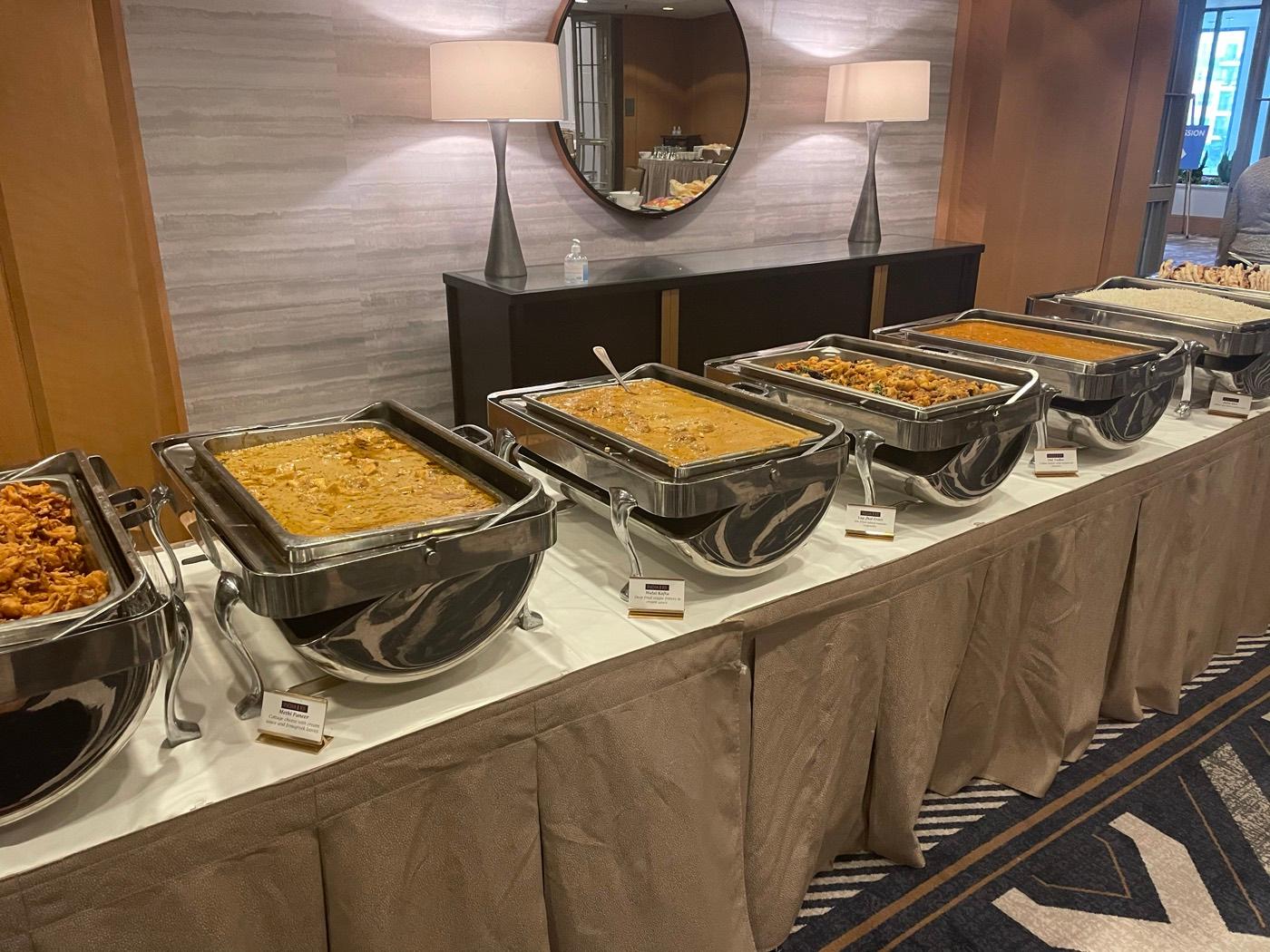 Chafing dishes of Indian curries kept warm at an India 101 catered event